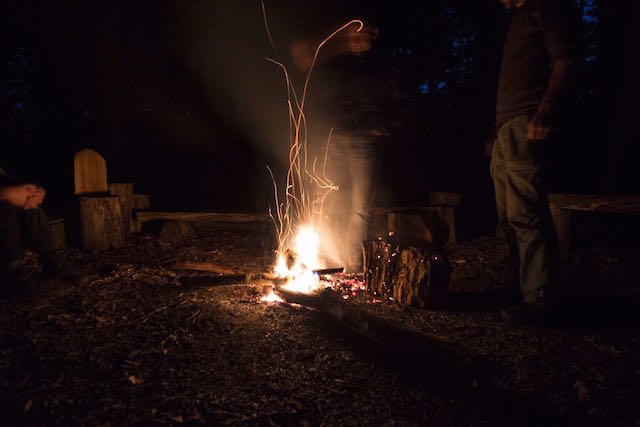 Fireside reflection at Hazel Hill wood. Photographer: Peter Clarkson